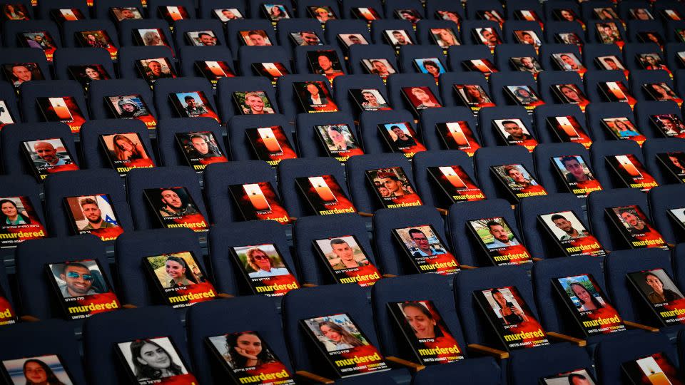 Pictures of over 1,000 people abducted, missing or killed in the Hamas attack are displayed on empty seats in the Smolarz Auditorium at Tel Aviv University in Tel Aviv, Israel, on Sunday. - Leon Neal/Getty Images