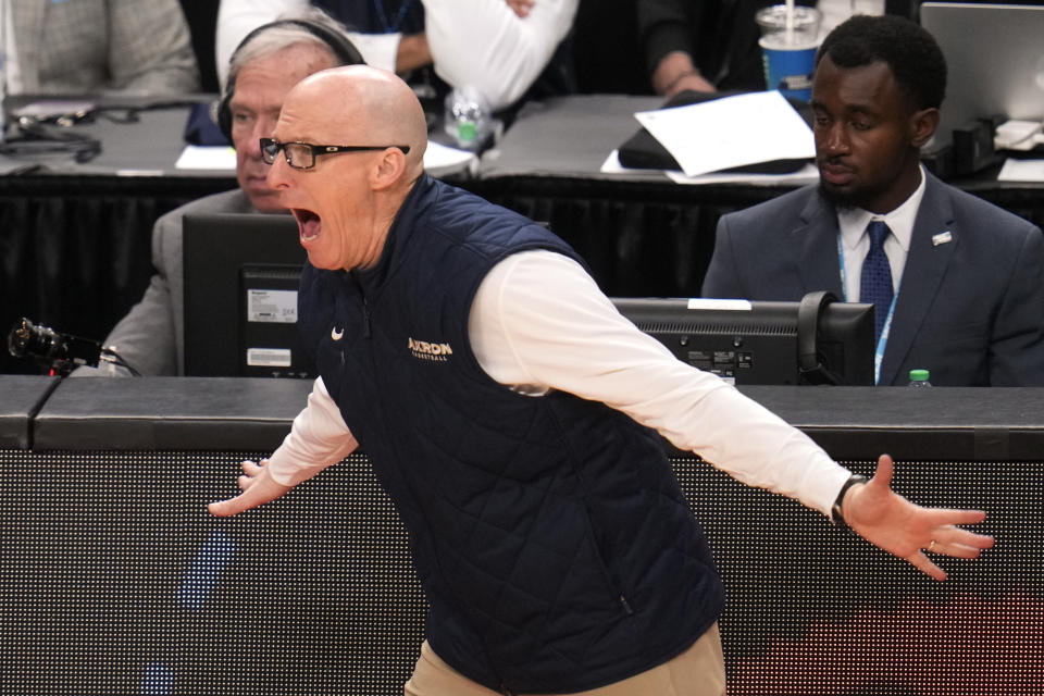 Akron head coach John Groce yells instructions during the second half of a college basketball game against the Creighton in the first round of the NCAA men's tournament in Pittsburgh, Thursday, March 21, 2024. Creighton won 77-60. (AP Photo/Gene J. Puskar)