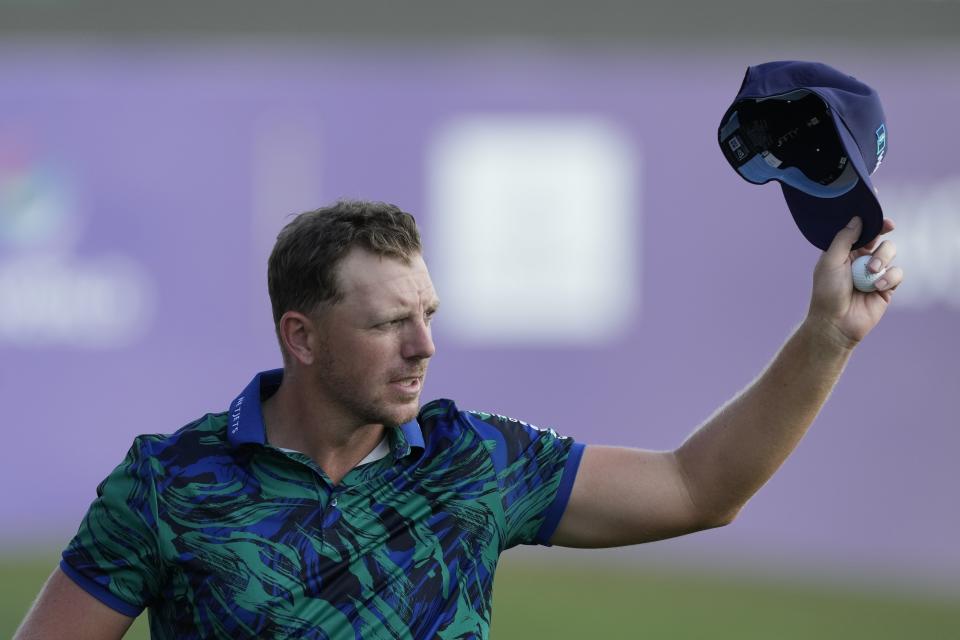 Matt Wallace of England reacts on the 18th hole during the round three of the DP World Tour Championship golf tournament, in Dubai, United Arab Emirates, Saturday, Nov. 18, 2023. (AP Photo/Kamran Jebreili)