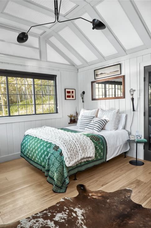 Wood Framed Mirror Above the Bed