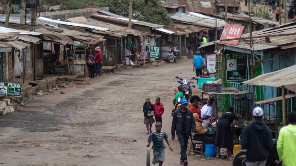 People walk down a street in Kibera neighborhood in Nairobi, Kenya, where a nationwide power blackout hit Sunday evening, paralyzing large parts of the country, including the main airport in the capital, a major transport hub connecting East Africa to Asia, Europe and other parts of the world. (Photo: Mosa’ab Elshamy/AP, File)