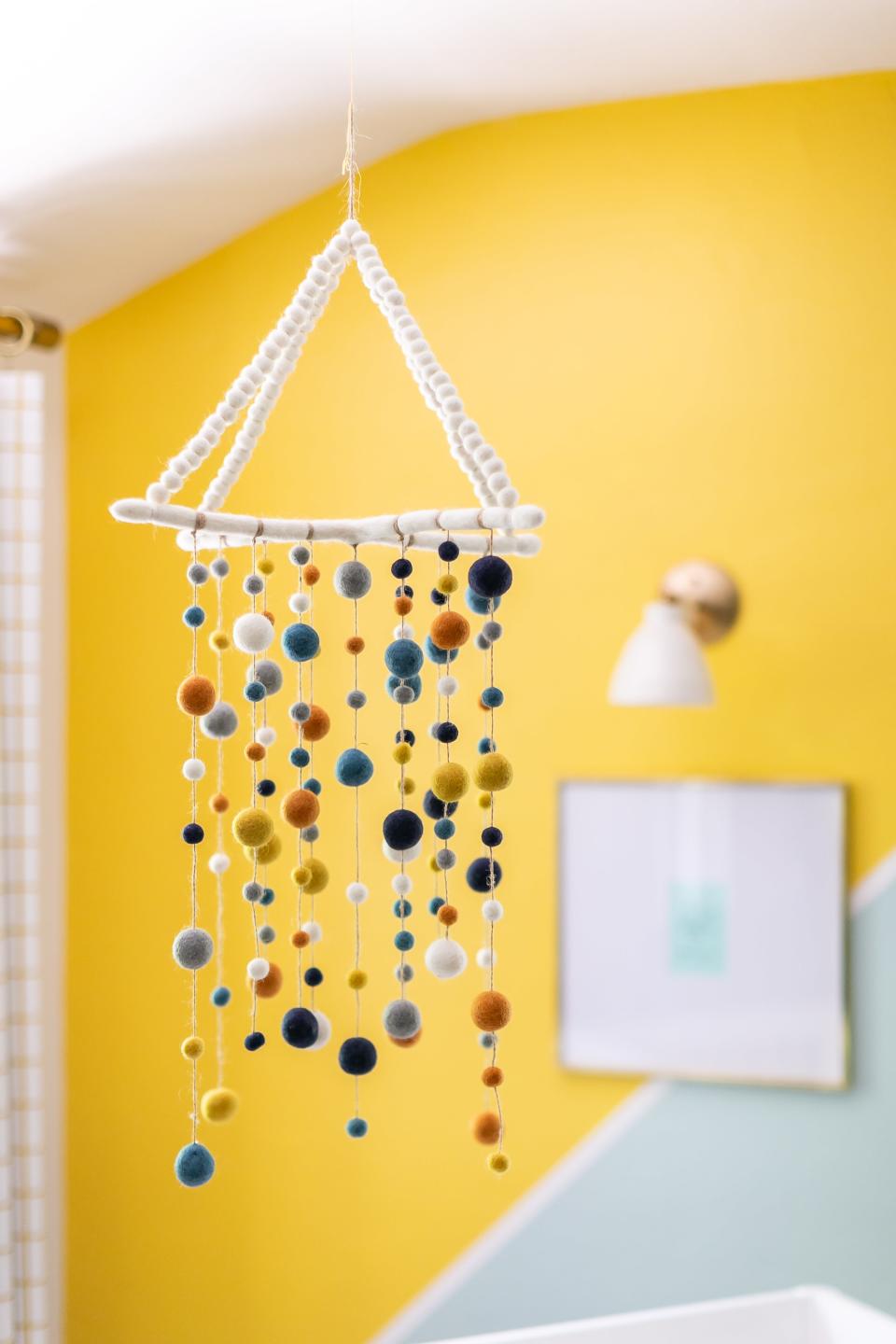 This West Elm x Pottery Barn Kids felted pom-pom mobile is a favorite piece for both Jane and Ferguson. “The colors matched the space in a delightful way, and the wool textures felt soothing,” she says.