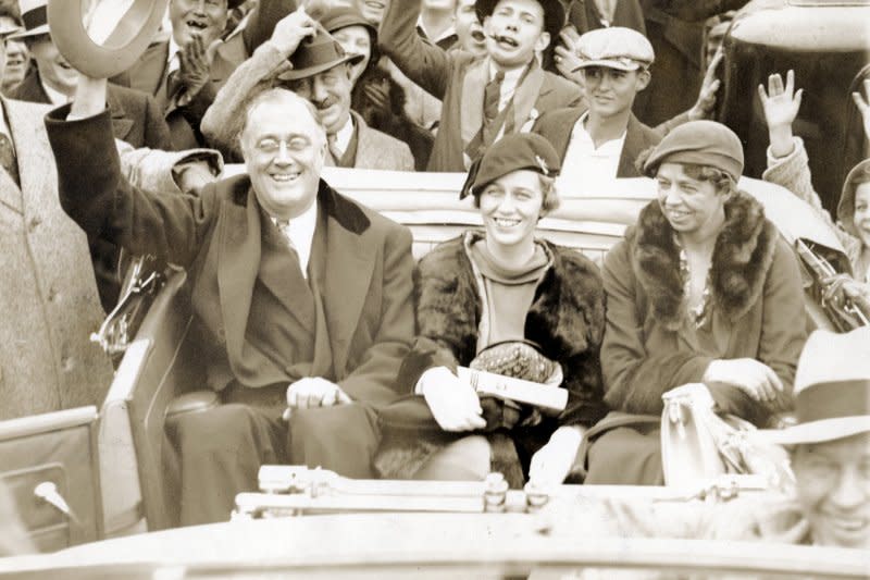 New York Gov. Franklin Delano Roosevelt rides in the back of an open top car with his daughter Anna Roosevelt Halsted (C) and wife Eleanor while campaigning in Warm Springs, Ga., on October 24, 1932. On July 1, 1932, Democrats nominated FDR for president. File Photo courtesy FDR Presidential Library