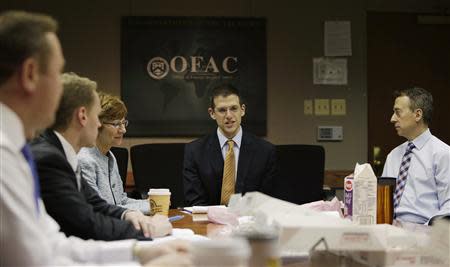 Office of Foreign Assets Control (OFAC) Director Adam Szubin and his staff meet at the U.S. Treasury Department in Washington March 26, 2014. REUTERS/Gary Cameron