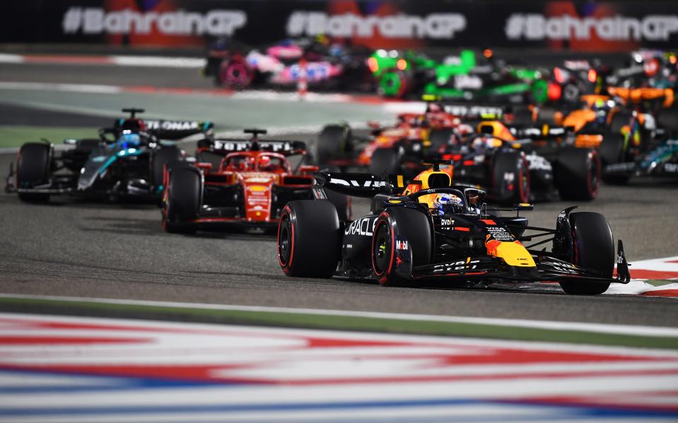 BAHRAIN, BAHRAIN - MARCH 02: Max Verstappen (1) leads Charles Leclerc (16) and the rest of the field during the F1 Grand Prix of Bahrain at Bahrain International Circuit on March 02, 2024 in Bahrain, Bahrain. (Photo by Rudy Carezzevoli/Getty Images)