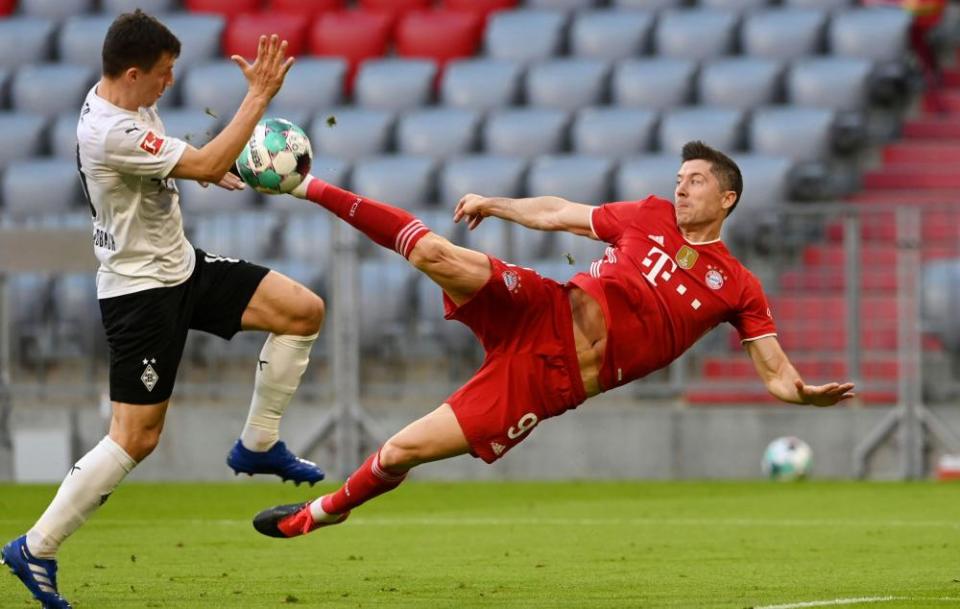 Robert Lewandowski scores one of his 48 goals for Bayern Munich last season – against Borussia Mönchengladbach last month.