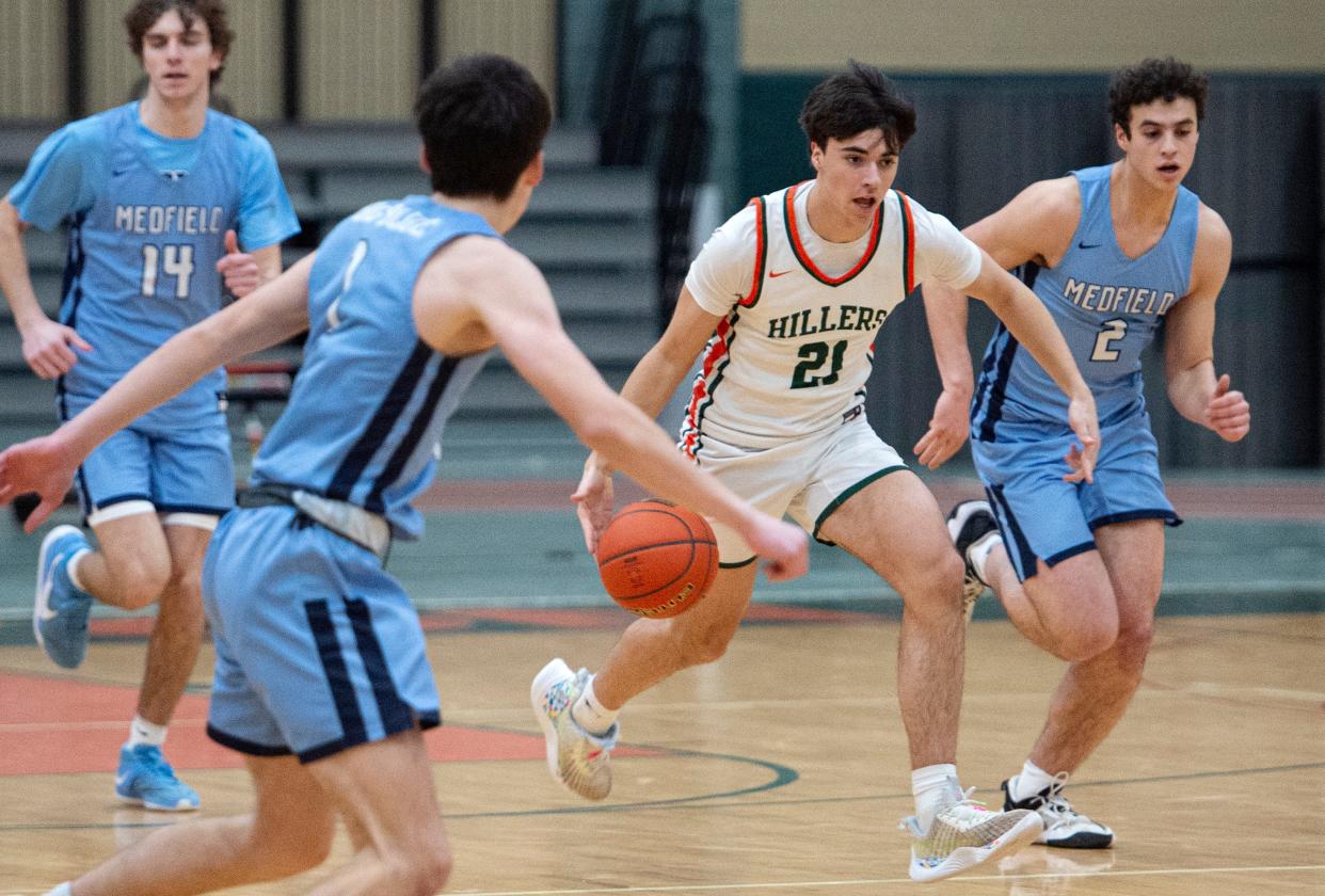 Hopkinton junior Sam Dadagian brings the ball up the court during the game against Medfield in Hopkinton, Feb. 6, 2024. The Hillers beat the Big Blue, 79-57.