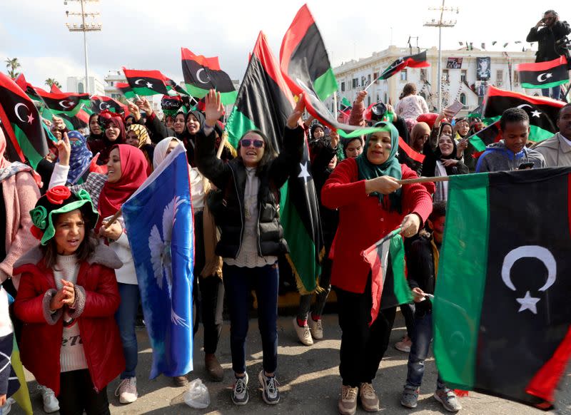 Libyans celebrate the 9th anniversary of the revolution at Martyrs' Square in Tripoli