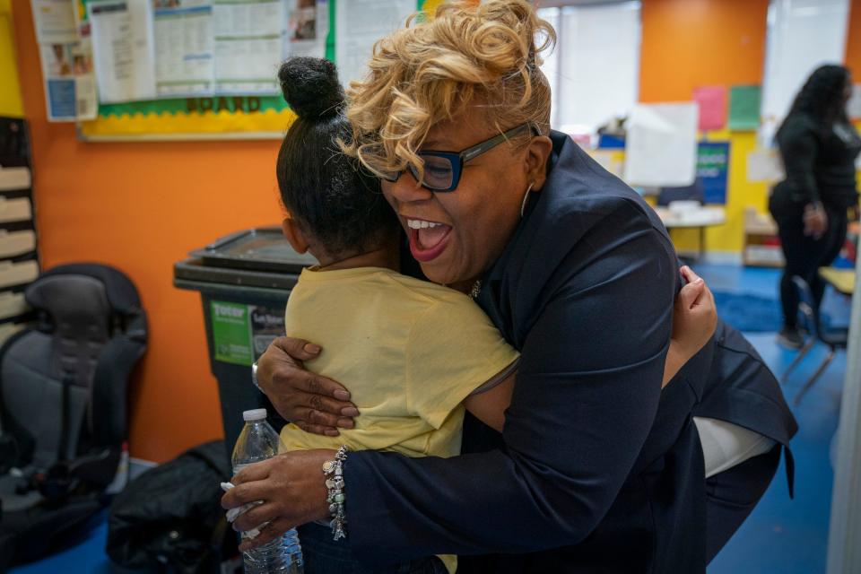 Cyriah Dukes, 4, gets a hug by Tissua Franklin as she arrives at the School of Purpose in Detroit on Wednesday, March 20, 2024. CEO of the school, Franklin is hoping to change the literacy preparation for children in Detroit. Franklin not only published a handbook to help educators and parents help their children but she has created a day care center that is focused on teaching children how to identify letters and numbers and words and to get a jump-start on reading before kindergarten.