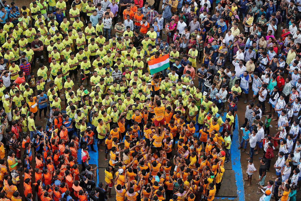 <p>Devotees form a human pyramid to celebrate the festival of Janmashtami, marking the birth anniversary of Hindu Lord Krishna, in Mumbai, India Aug. 25, 2016. (Photo: Shailesh Andrade/Reuters) </p>