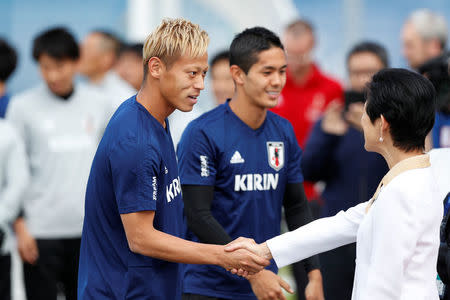 Soccer Football - World Cup - Japan Training - Japan Training Camp, Kazan, Russia - June 21, 2018 Japan's Princess Takamado shakes hands with Keisuke Honda during training REUTERS/John Sibley