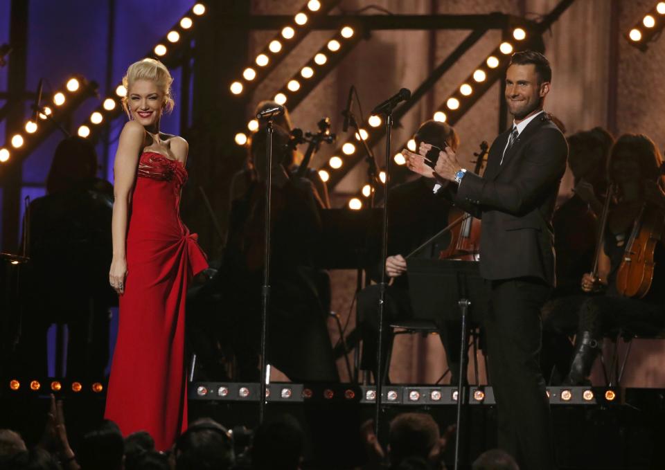 Gwen Stefani smiles after performing "My Heart is Open" with Adam Levine at the 57th annual Grammy Awards in Los Angeles