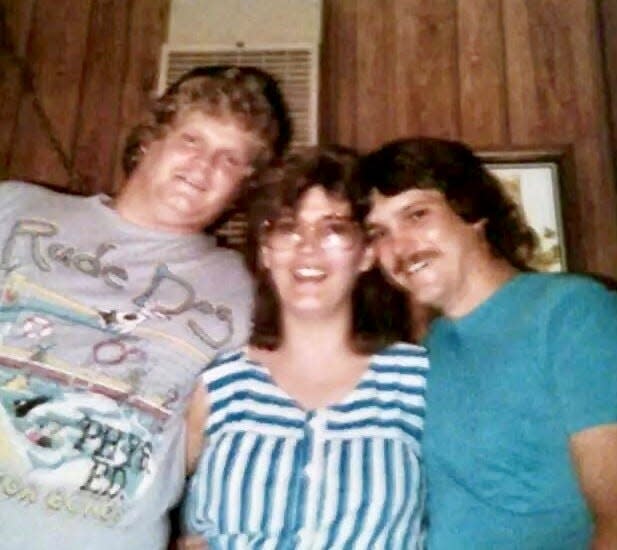 Brian Scott Dutcher Sr., left, poses in this 1988 photo with his sister Brenda Ramsey and his brother Ken Dutcher. He died in 2002 after an infection in a wisdom tooth traveled to his brain.