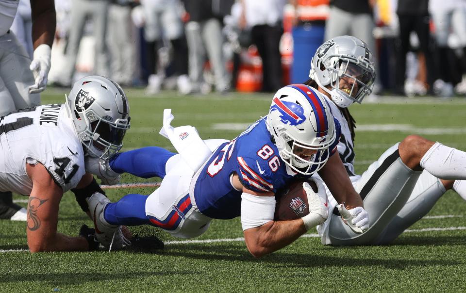 Bills tight end Dalton Kincaid dives for extra yards against the Raiders.