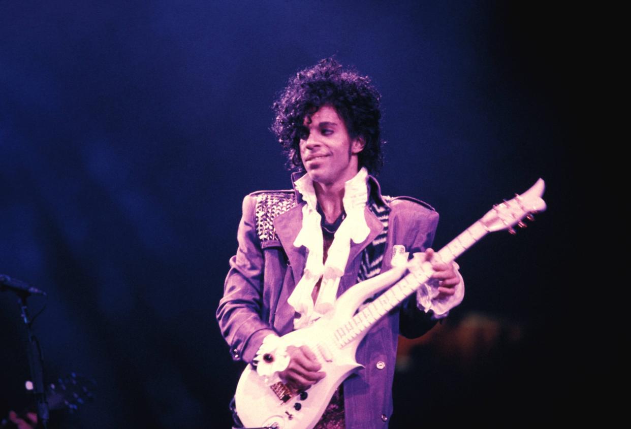 Prince Album Covers pictured: Prince performing on his Purple Rain Tour | (Photo by Richard E. Aaron/Redferns)