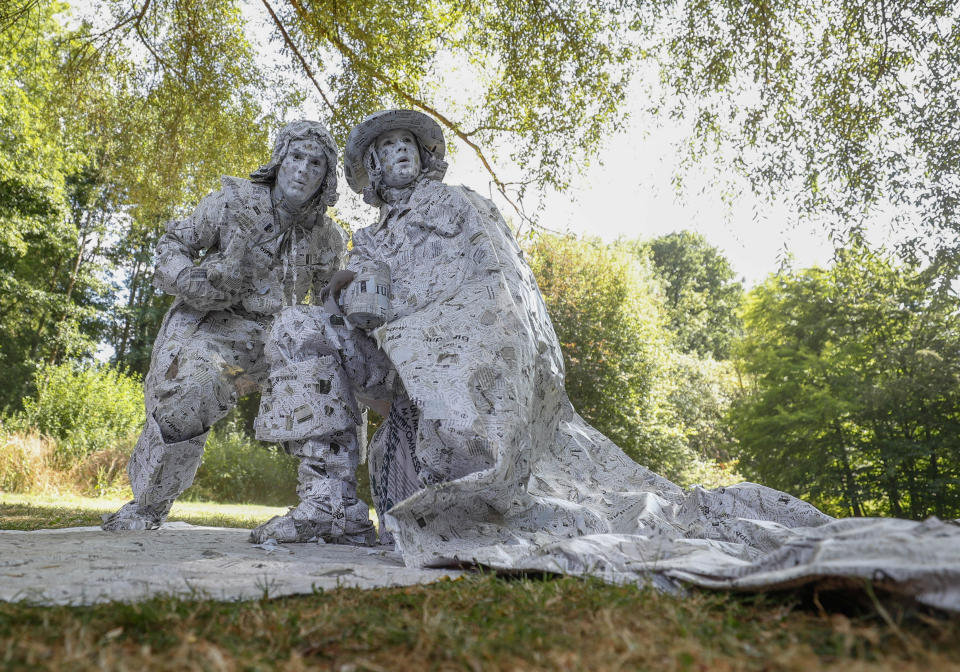 <p>Artists called “Les hommes de papier” take part in the festival “Statues en Marche” in Marche-en-Famenne, Belgium, July 22, 2018. (Photo: Yves Herman/Reuters) </p>