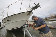 Charles Bungart gets his boat out of the water as Tropical Storm Gordon approaches on Tuesday, Sept. 4, 2018, in Dauphin Island, Ala. (AP Photo/Dan Anderson)