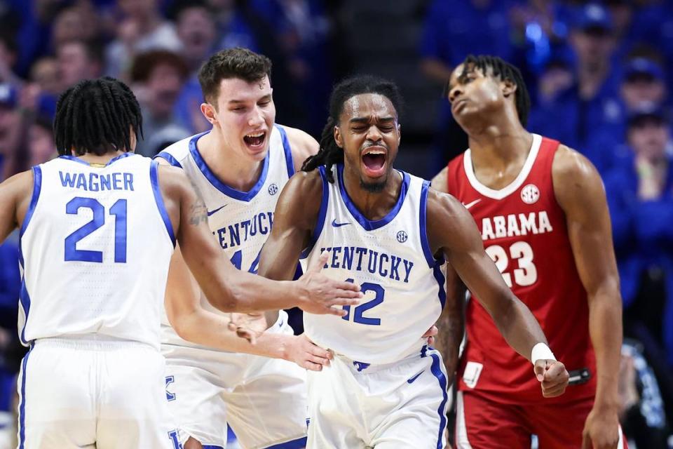 Kentucky’s Antonio Reeves (12) celebrates with D.J. Wagner (21) and Zvonimir Ivisic during a game in Rupp Arena. The Wildcats enter the NCAA Tournament with the one of the nation’s highest-scoring offenses but doubts about its defense.