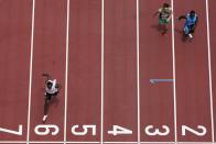 Dorian Keletela, of Refugee Olympic Team, wins his heat during the men's 100-meter at the 2020 Summer Olympics, Saturday, July 31, 2021, in Tokyo. (AP Photo/Morry Gash)