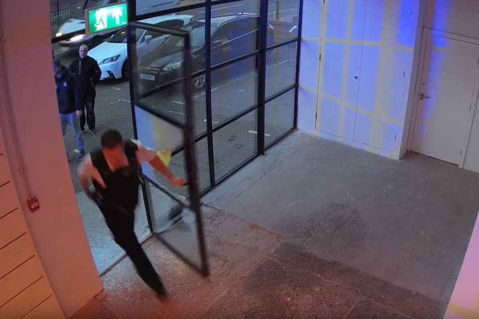 CCTV footage shows police breaking into the gallery after reports of a body (Kollier Din-Bangura)