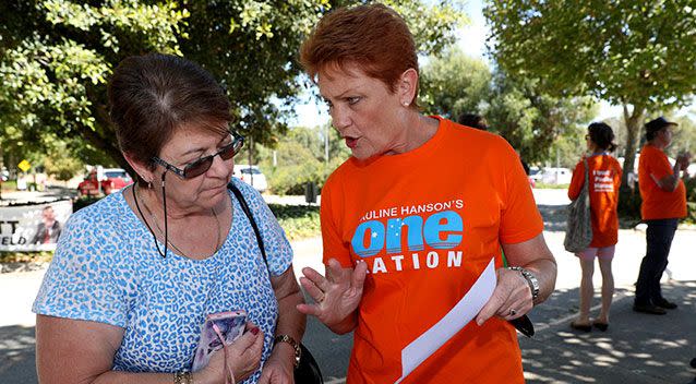 Ms Hanson handed out how-to-vote cards on Saturday. Picture: AAP