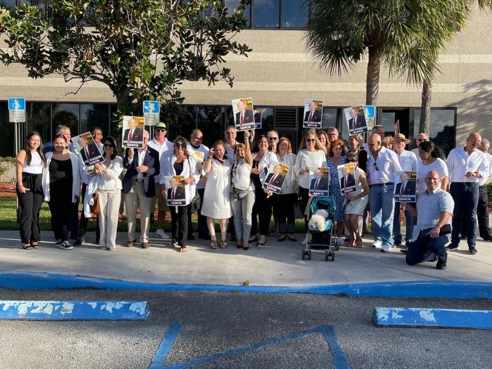 Supporters of naming Palm Beach County's newest high school after Dr. Joaquín García gather outside the school district office on Nov. 2, 2022. The school board voted unanimously to name the school after the late doctor and businessman.