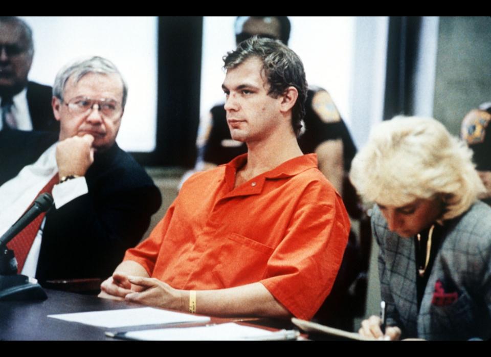 Notorious cannibal Jeffrey Dahmer sits with his defense team during his 1991 trial. Dahmer went on a killing spree in the 1980s during which he murdered 17 men and boys. He often had sex with the corpses before dismembering them and, in some cases, ate pieces of human flesh. After his conviction, Dahmer was killed by a fellow inmate in prison. 