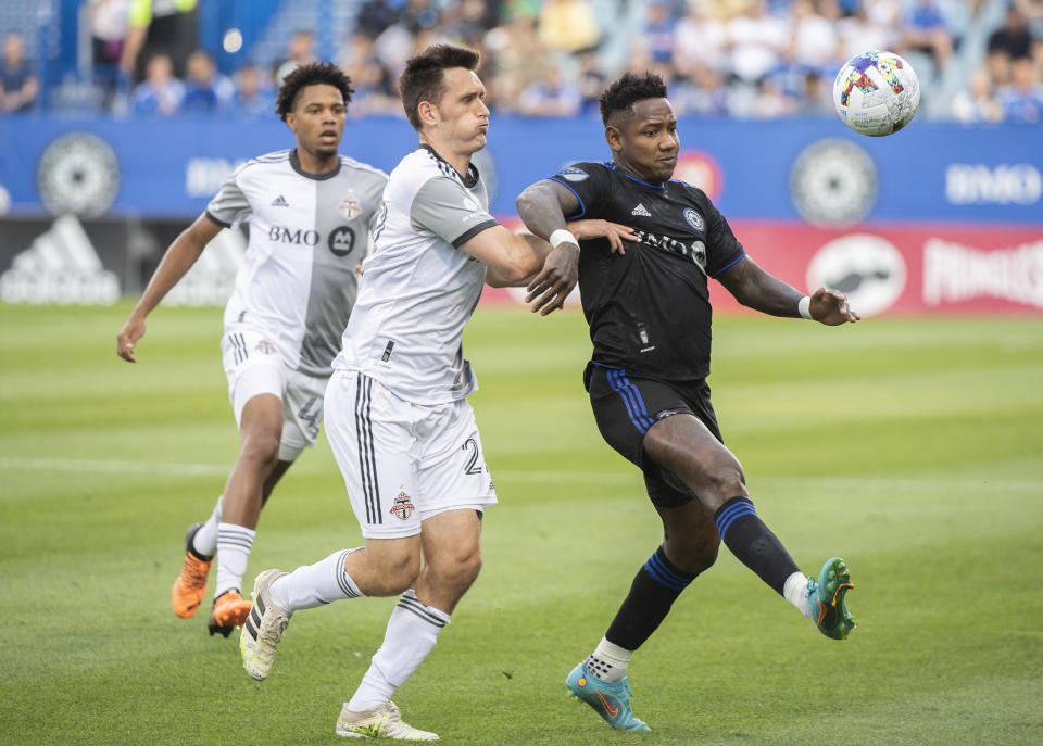 CF Montreal's Romell Quioto, right, is defended by Toronto FC's Shane O'Neill during the first half of an MLS soccer match Saturday, July 16, 2022, in Montreal. (Graham Hughes/The Canadian Press via AP)