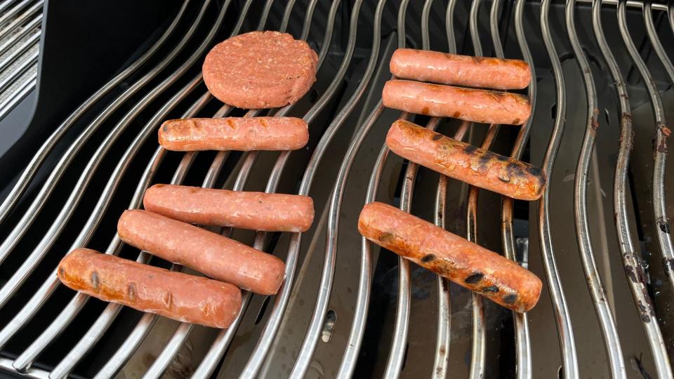 A close up of burgers made on the Napoleon Phantom Rogue SE 425 RSIB