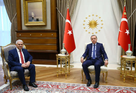 Turkish President Tayyip Erdogan (R) meets with incoming Prime Minister Binali Yildirim at the Presidential Palace in Ankara, Turkey, May 22, 2016. Kayhan Ozer/Presidential Palace/Handout via REUTERS