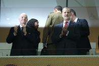 King Felipe VI of Spain, right, and FIFA President Gianni Infantino applaud before the World Cup group E soccer match between Spain and Costa Rica, at the Al Thumama Stadium in Doha, Qatar, Wednesday, Nov. 23, 2022. (AP Photo/Alessandra Tarantino)