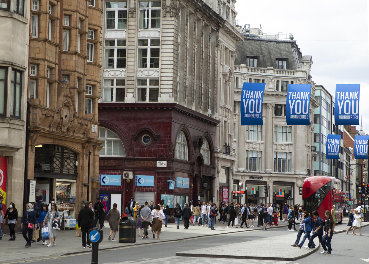 Crowds gather in Oxford Street with &quot;Thank you&quot; signs above them as people in London, UK on July 11, 2020  prepare for the possibility of Face coverings becoming mandatory in shops and other public places across the UK.  (Photo by Jacques Feeney/MI News/NurPhoto via Getty Images)