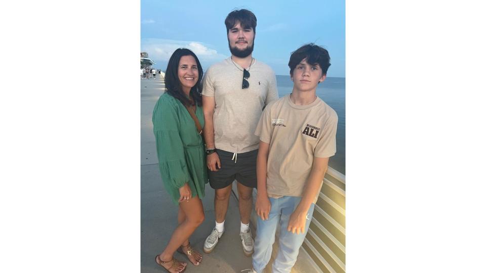 Donna and her 2 sons, Oliver, 19 and Billy, 13 on the St Petersburg pier 