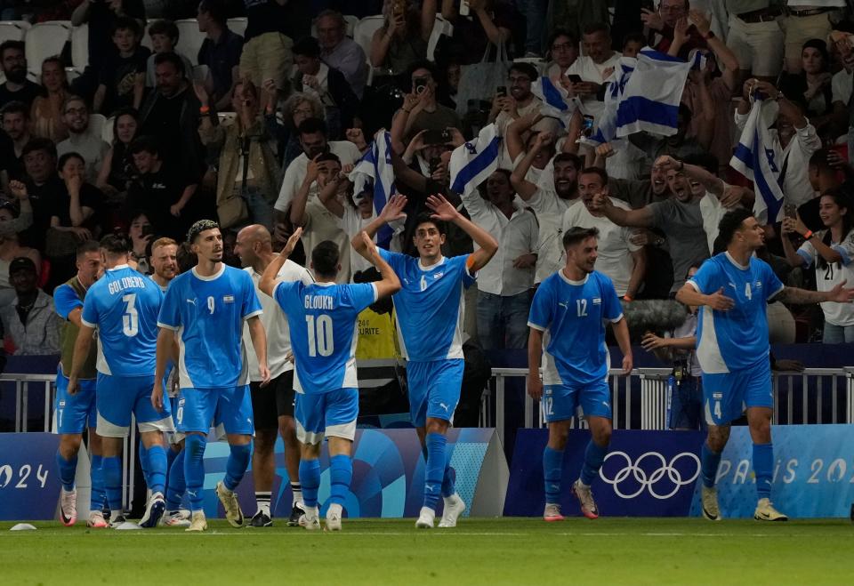 Team Israel midfielder Oscar Gloukh (10) and teammates celebrate a goal against Mali on Wednesday night.