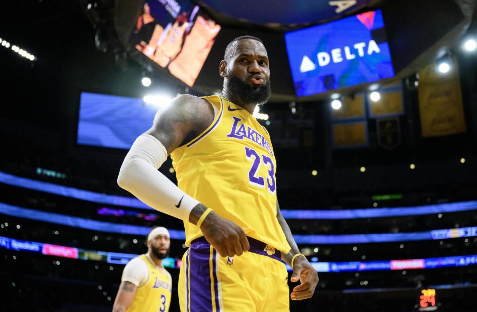 Lakers star LeBron James reacts after scoring on a fast-break layup against the Atlanta Hawks.