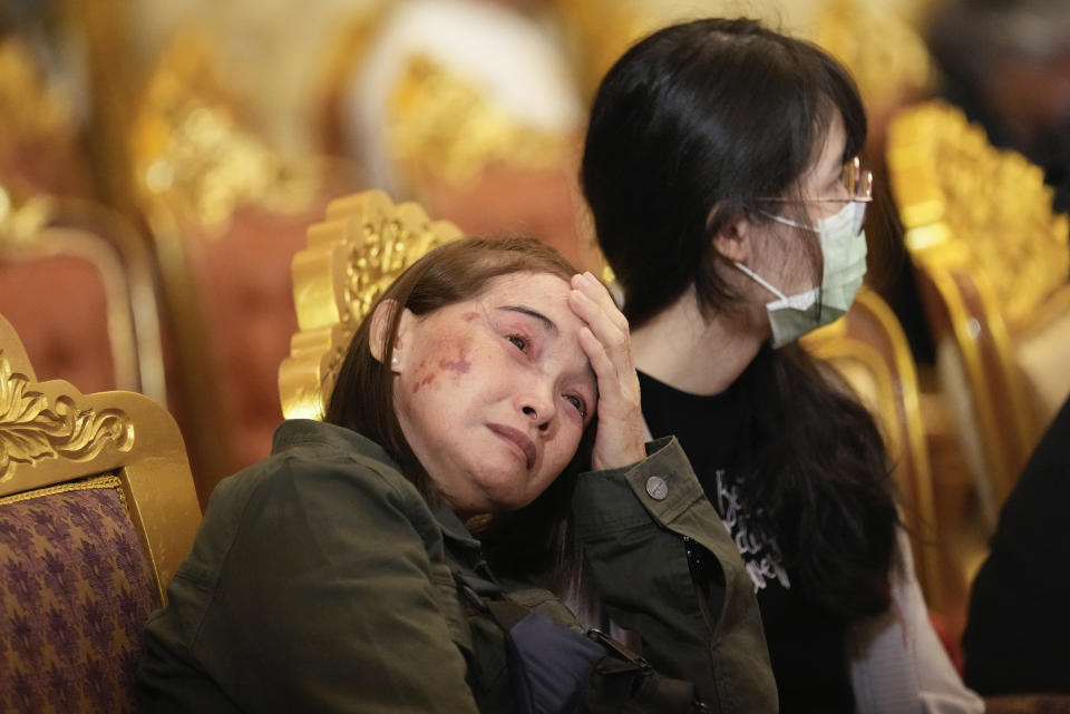 Family members of Duangphet Phromthep cry during a funeral ceremony at Wat Phra That Doi Wao temple in Chiang Rai province Thailand, Saturday, March 4, 2023. The cremated ashes of Duangphet, one of the 12 boys rescued from a flooded cave in 2018, arrived in the far northern Thai province of Chiang Rai on Saturday where final Buddhist rites for his funeral will be held over the next few days following his death in the U.K. (AP Photo/Sakchai Lalit)