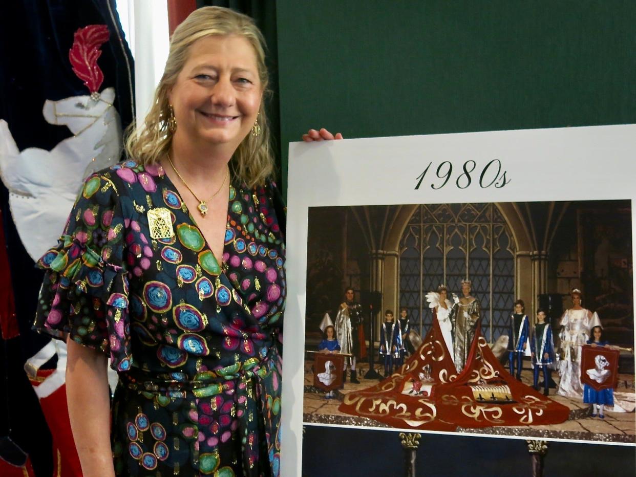 Marjorie Querbes Briley by the photo of the Cotillion Royal Court of 1988 in which she was Queen XXXIX.