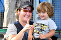 <p>Bronze medalist Kimberly Rhode of the United States holds her son at the women’s final skeet shooting event.</p>