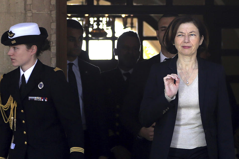 France's Defense Minister Florence Parly, right, leaves the Presidential Palace after talks with Cypriot President Nicos Anastasiades in capital Nicosia, Cyprus, Tuesday, Feb. 18, 2020. Parly said on Tuesday that her country stands in solidarity with Cyprus amid tensions over a Turkish search for natural gas inside Cypriot waters. (AP Photo/Petros Karadjias)