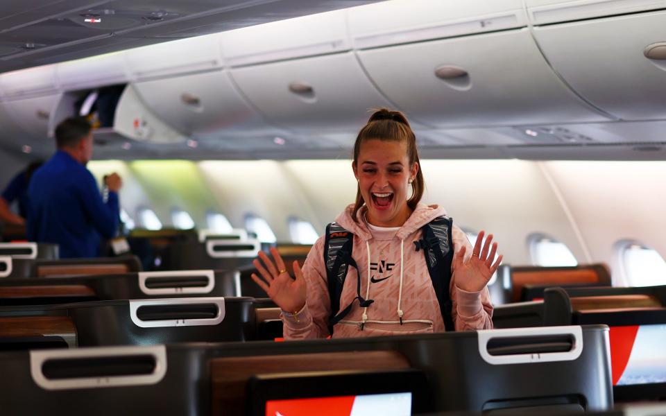 Ella Toone of England on the plane as the Lionesses depart for the FIFA Women's World Cup at Heathrow Airport