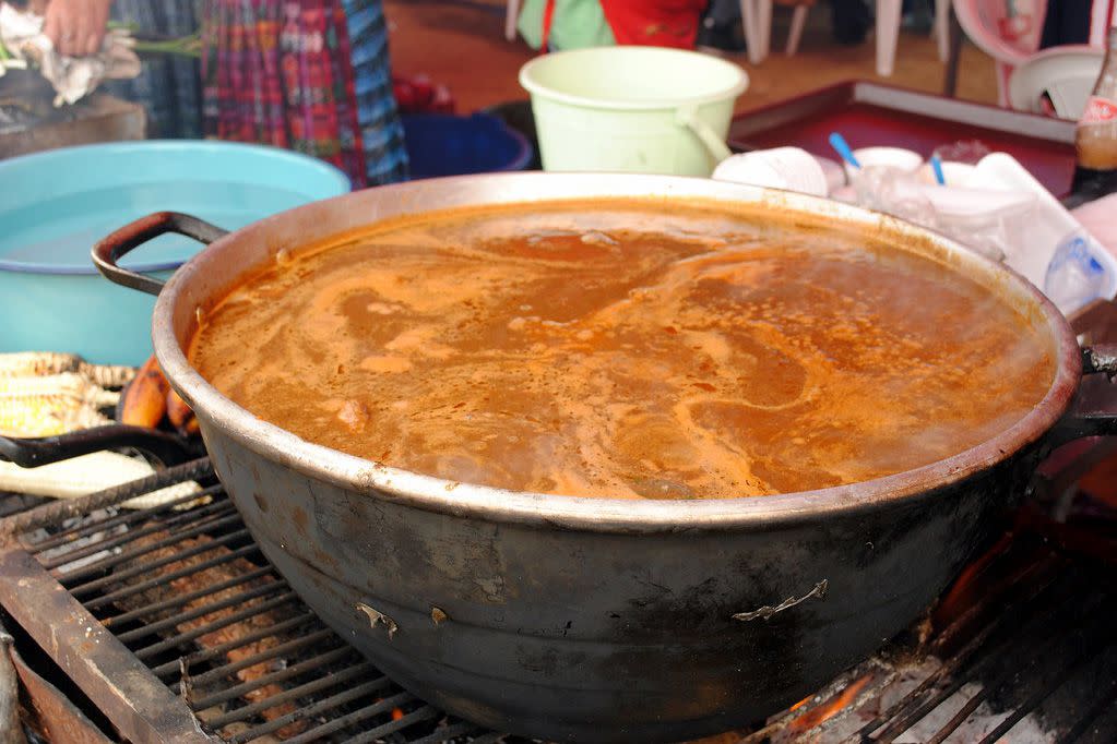 pot of pepián still on the fire but ready to be served