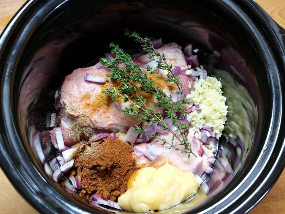 cooking meat in the slow cooker with spices, herbs, and flavorings