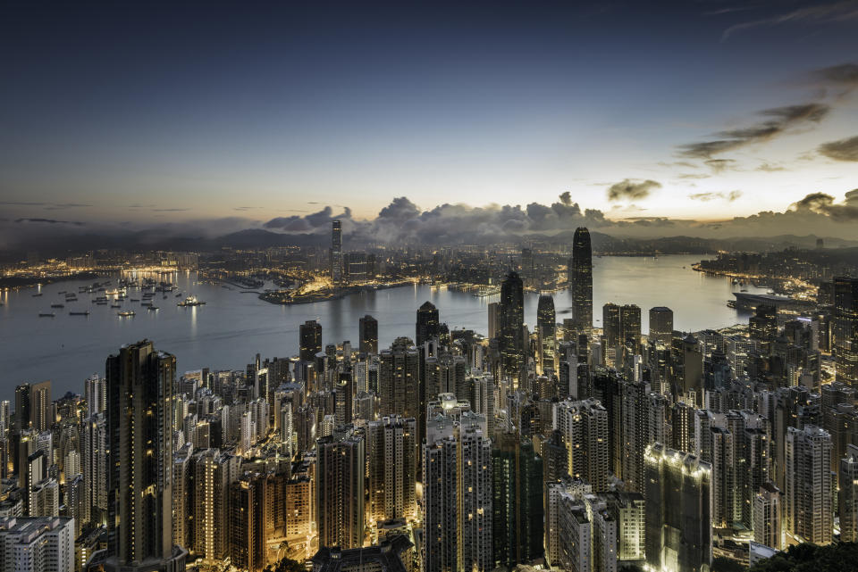 Asia, China, Hong Kong, elevated view of the skyline and victoria bay at dawn, showing the financial district