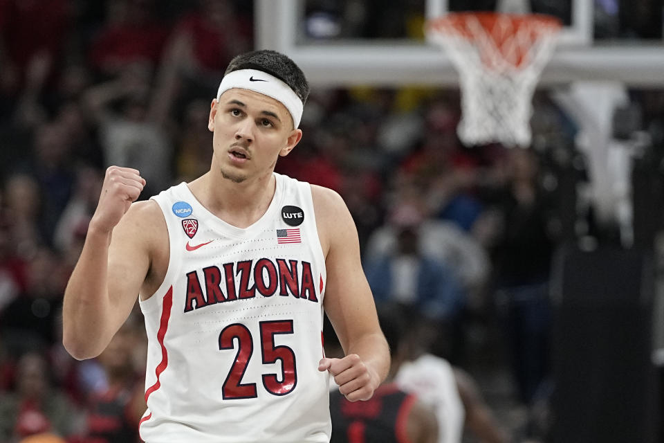 FILE - Arizona guard Kerr Kriisa celebrates after scoring against Houston during the second half of a college basketball game in the Sweet 16 round of the NCAA tournament on Thursday, March 24, 2022, in San Antonio. Arizona enters its second season under Tommy Lloyd with several new players, but it's a mix that's expected to make the former longtime Gonzaga assistant 2 for 2 in NCAA Tournament appearances. (AP Photo/David J. Phillip, File)