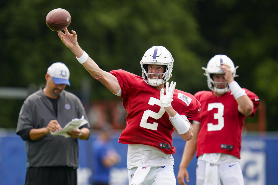 Indianapolis Colts quarterback Matt Ryan (2) throws in front of quarterback Jack Coan (3) during practice at the NFL team's football training camp in Westfield, Ind., Tuesday, Aug. 2, 2022. (AP Photo/Michael Conroy)