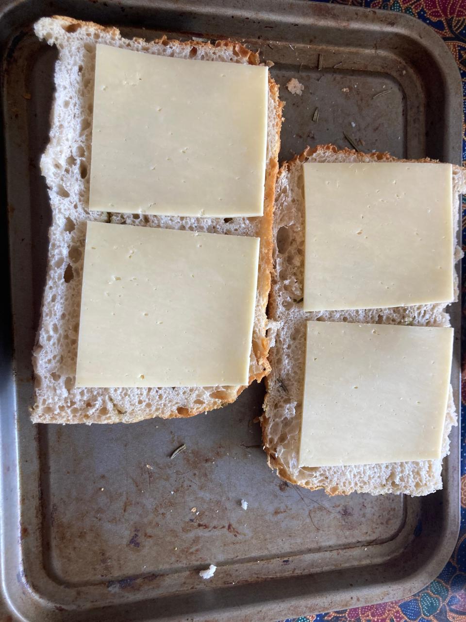 A picture of cheese on two pieces of focaccia.