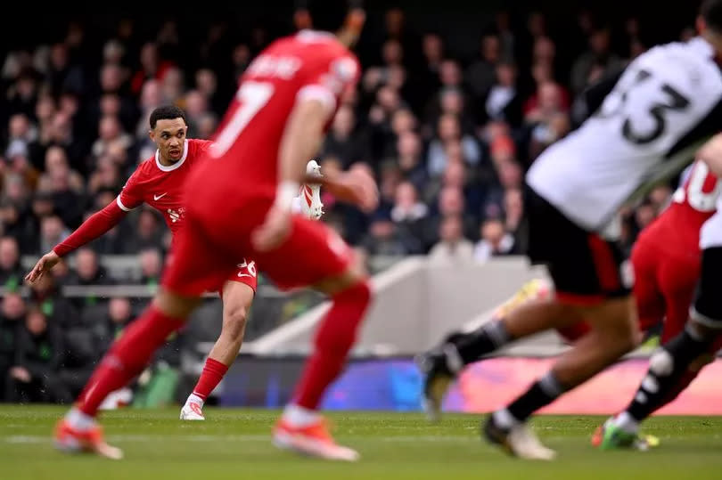 Trent Alexander-Arnold of Liverpool scoring the opening goal during the Premier League match between Fulham FC and Liverpool FC at Craven Cottage on April 21, 2024 in London, England.