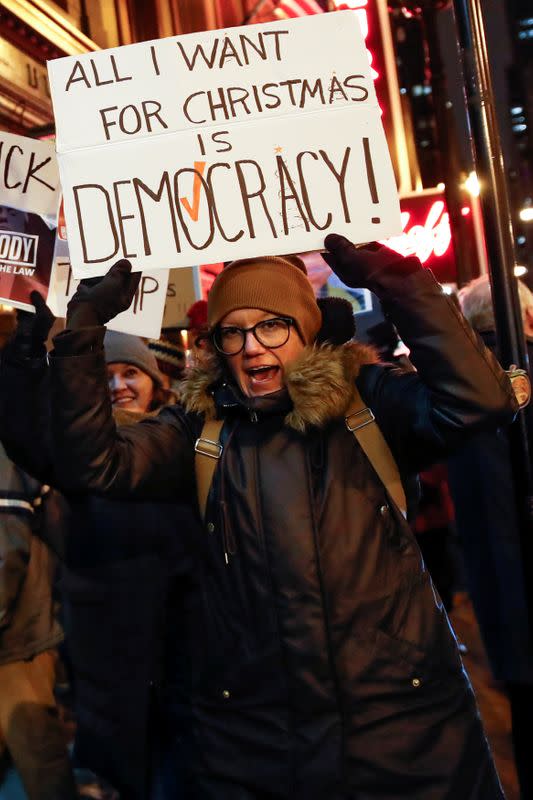 Protesters take part in a rally to support the impeachment and removal of President Trump in Chicago