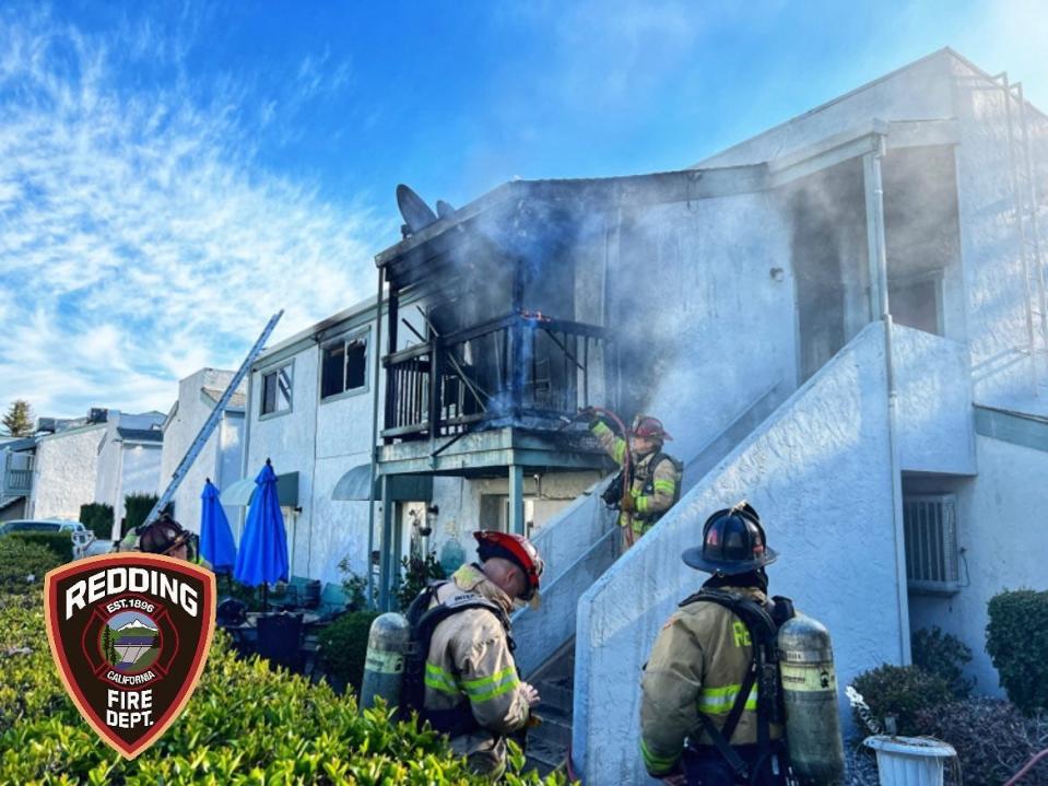 Firefighters respond to a second alarm fire that caused $110,000 in damages to a Redding apartment building on Wednesday, April 12, 2023.