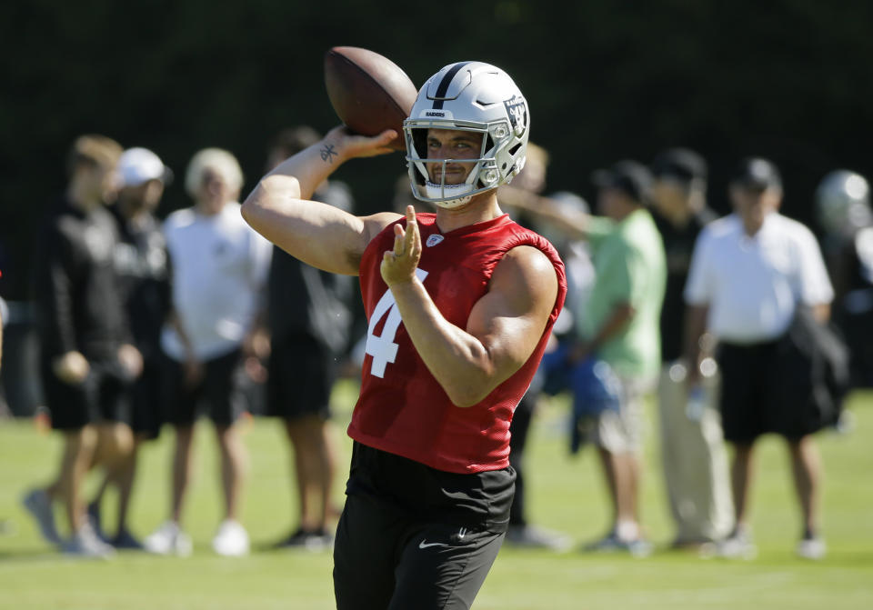 Oakland Raiders quarterback Derek Carr throws during NFL football training camp Saturday, July 27, 2019, in Napa, Calif. (AP Photo/Eric Risberg)